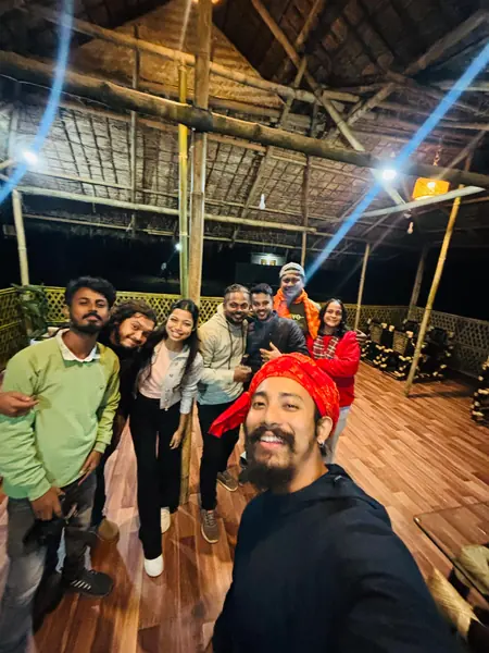 A cheerful group selfie after sunset