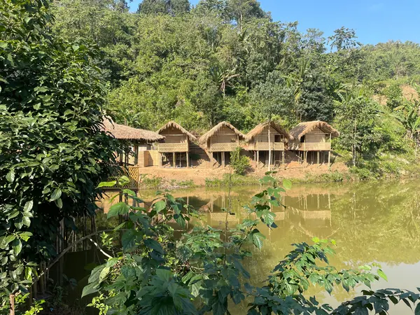 Bamboo cottages beside the water